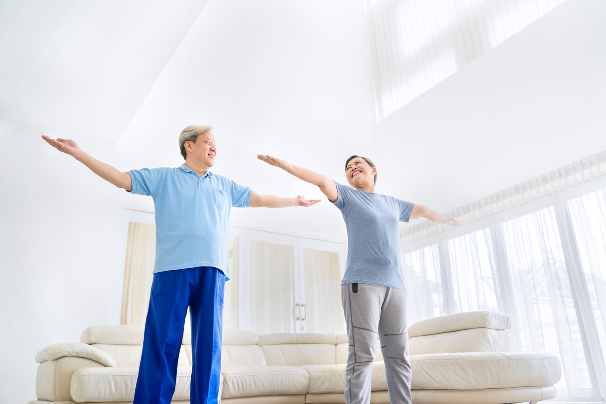 Elderly Couple Working Out in the Living Room 